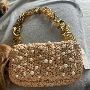 Anthropologie Cream and Gold Mini Bag with Tortoise Chain.